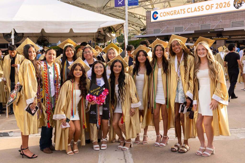 Conroe High School graduates in gold gowns celebrating the Class of 2026