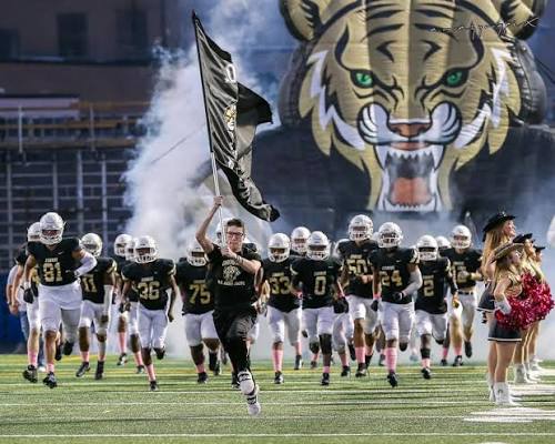 CHS Tigers football team taking the field